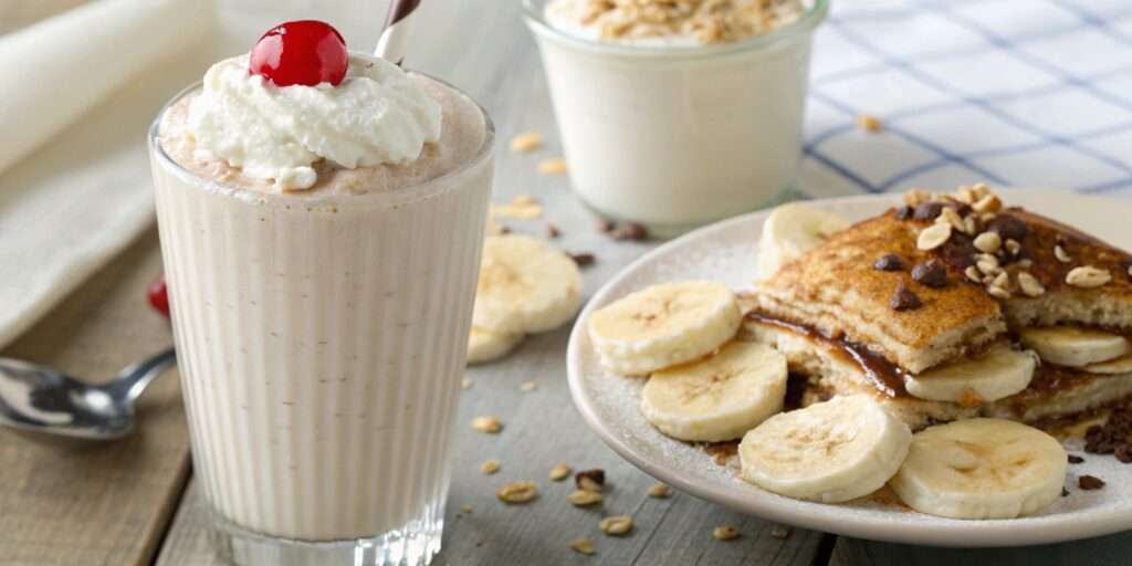 High-protein milkshake with peanut butter and almonds for muscle recovery.
